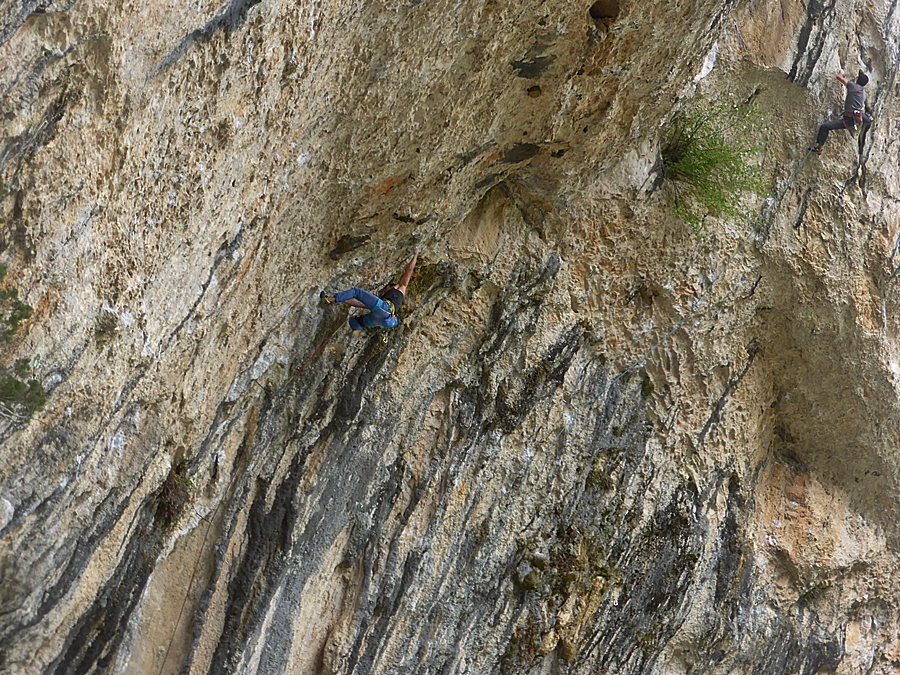 Unknown climber about to reach the cave on Coliseum, Rodellar. 